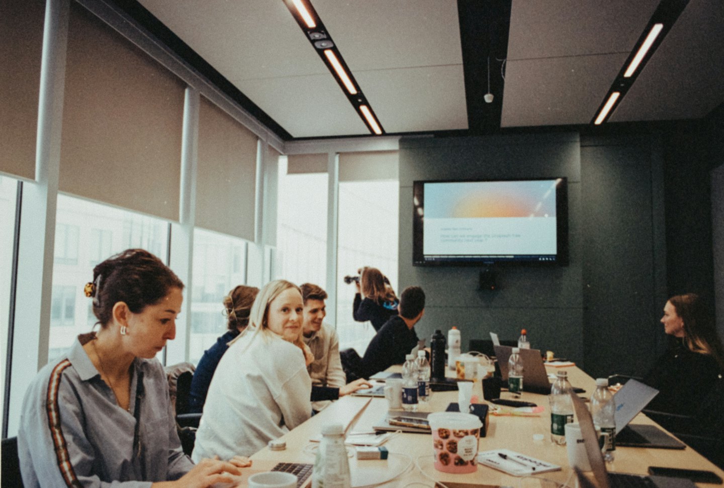 Diverse professionals collaborating around a conference table.